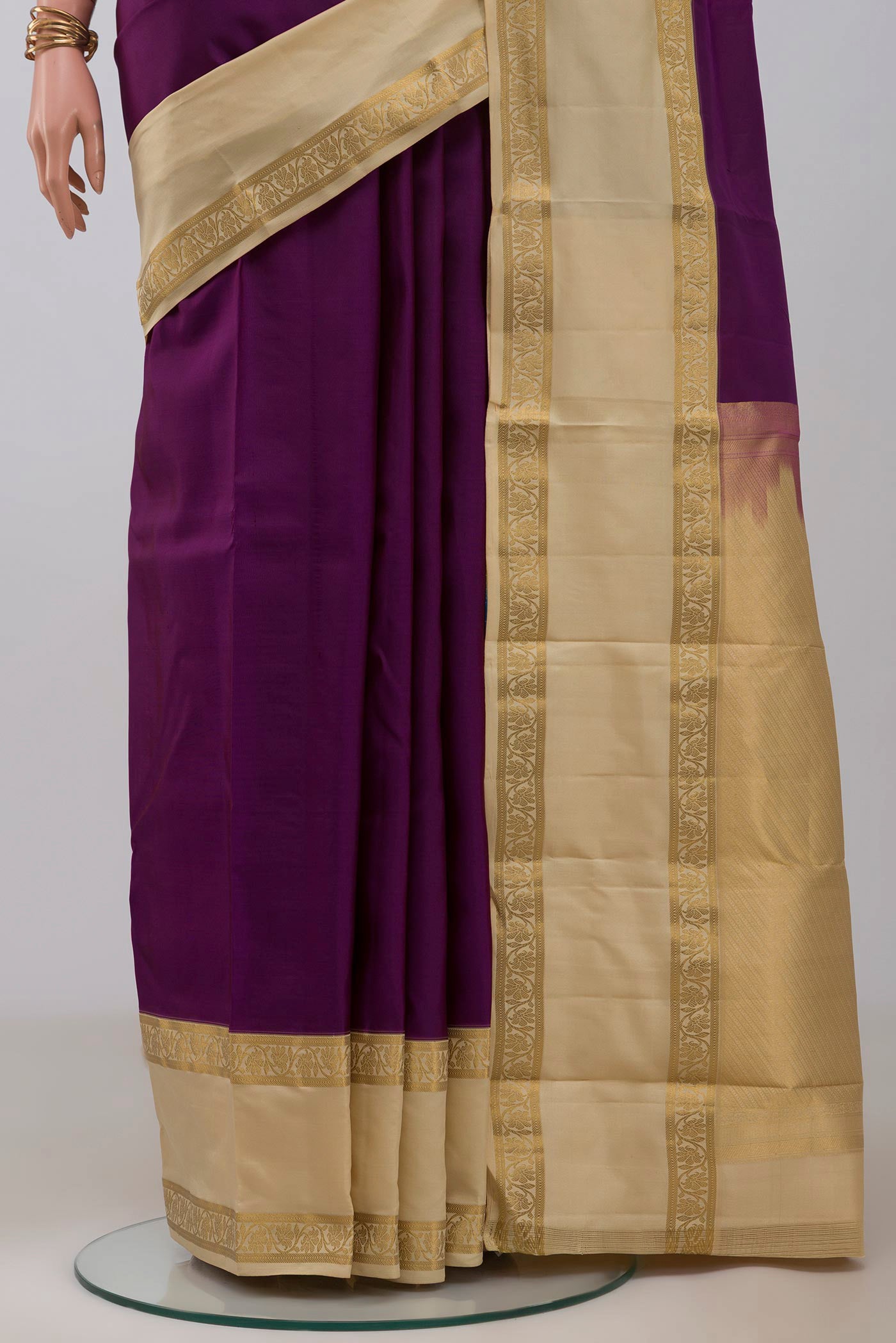 Pleats and pallu of Purple Kanchipuram Silk Saree with Plain Body and Zari Border. 