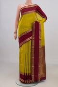 Pure Silk Yellow Kanchipuram Saree with Plain Body and Zari Border.  displayed on a mannequin