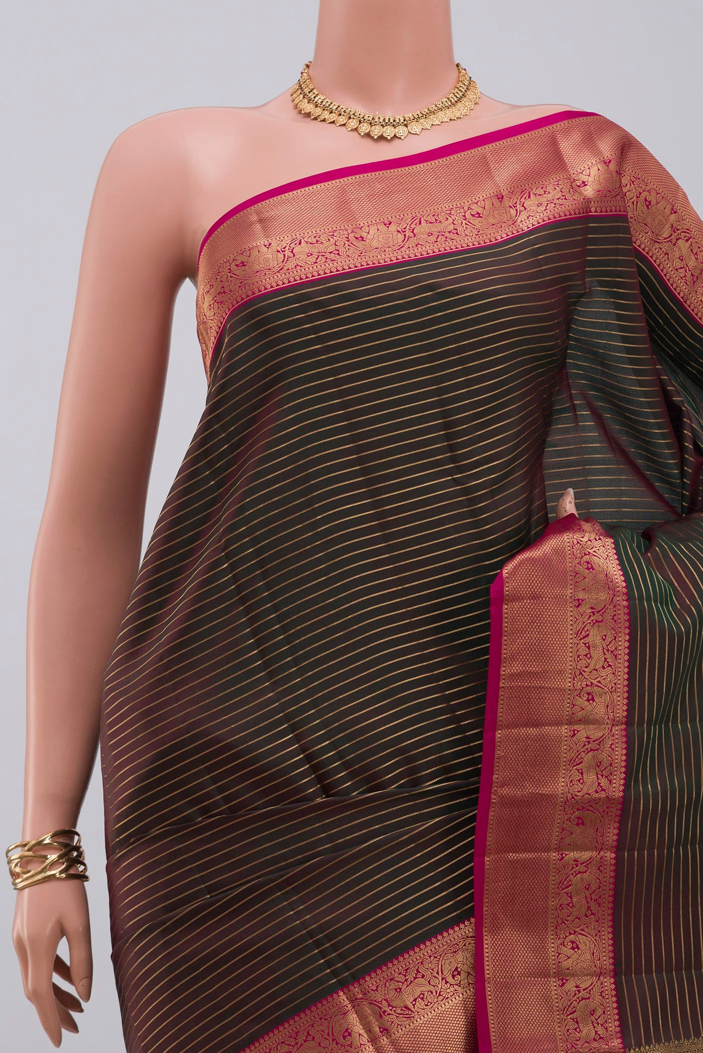 Border image of Green Kanjivaram Saree with Stripes on the body and Zari Border. 
