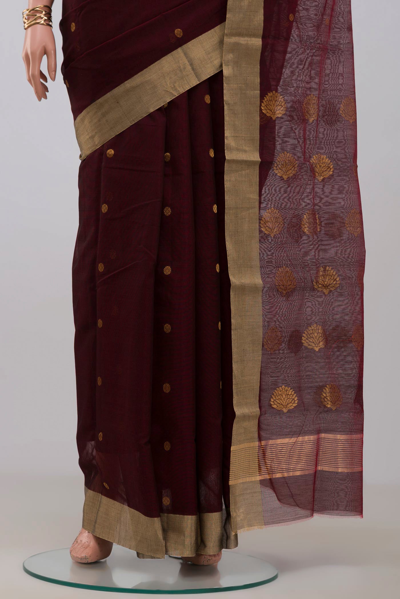 Pleats and pallu of Maroon Chanderi Silk Cotton Saree with Zari Butta on the body and Zari Border. 