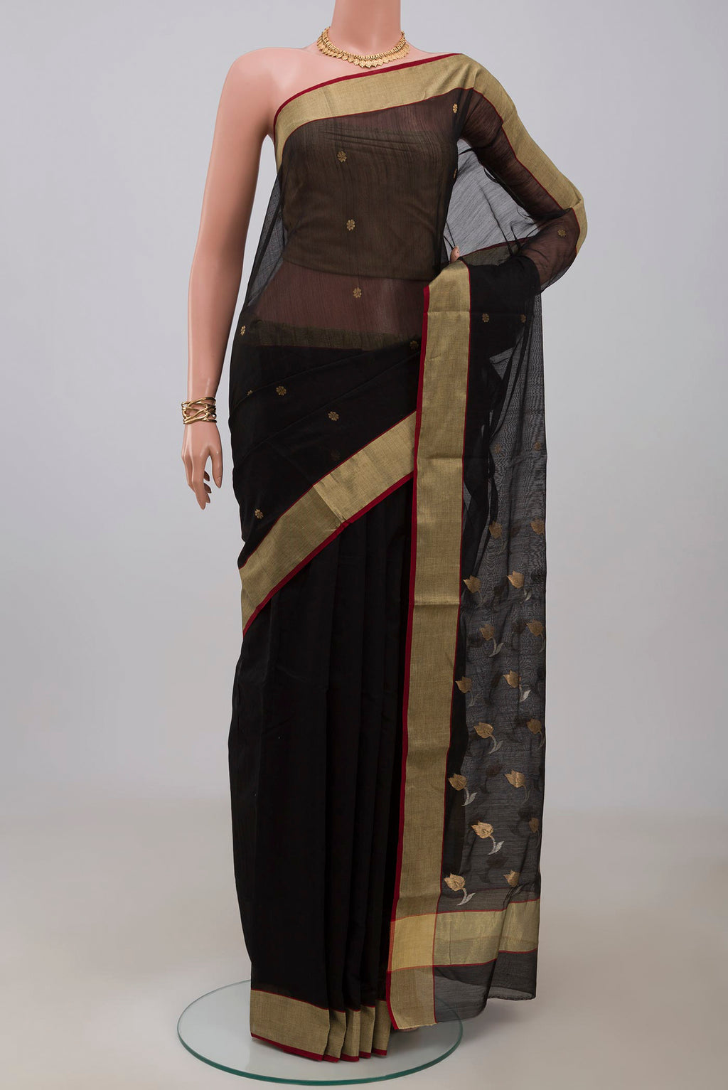 Black Chanderi Silk Cotton Saree with Zari Butta on the body and Zari Border.  displayed on a mannequin
