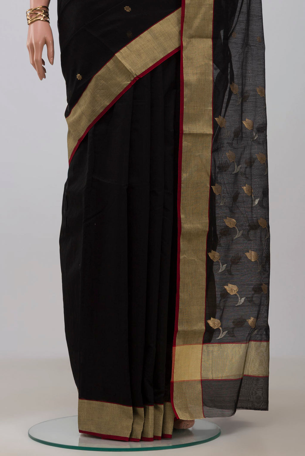 Pleats and pallu of Black Chanderi Silk Cotton Saree with Zari Butta on the body and Zari Border. 