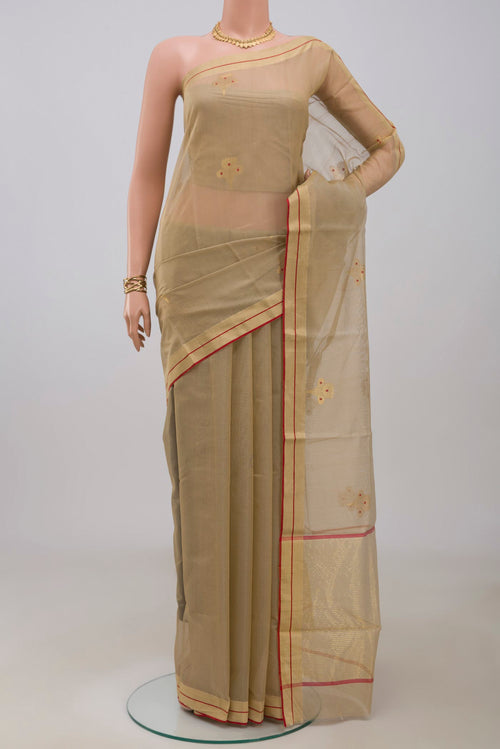 Beige Chanderi Silk Cotton Saree with Zari And Thread Butta on the body and Zari Border.  displayed on a mannequin