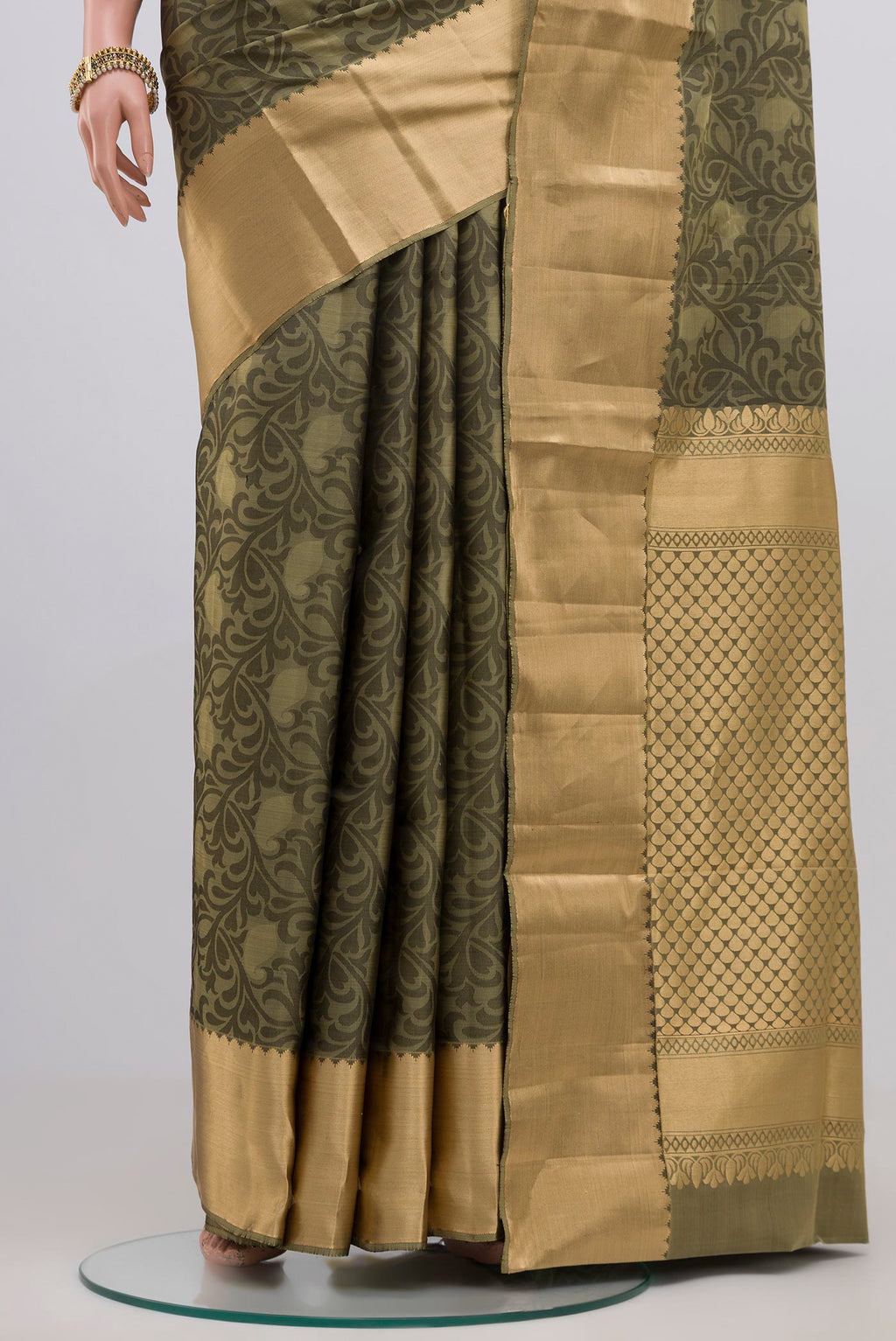 Pleats and pallu of Green Soft Silk Saree with Jacquard design on the body and Zari Border. 