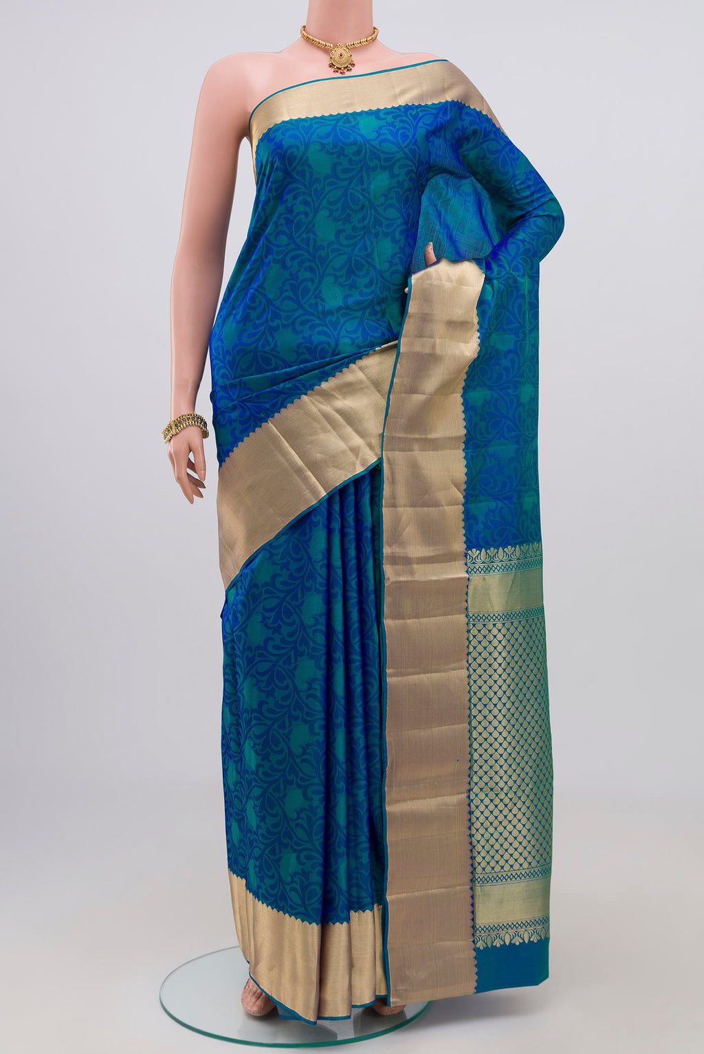 Blue Soft Silk Saree with Jacquard design on the body and Zari Border.  displayed on a mannequin