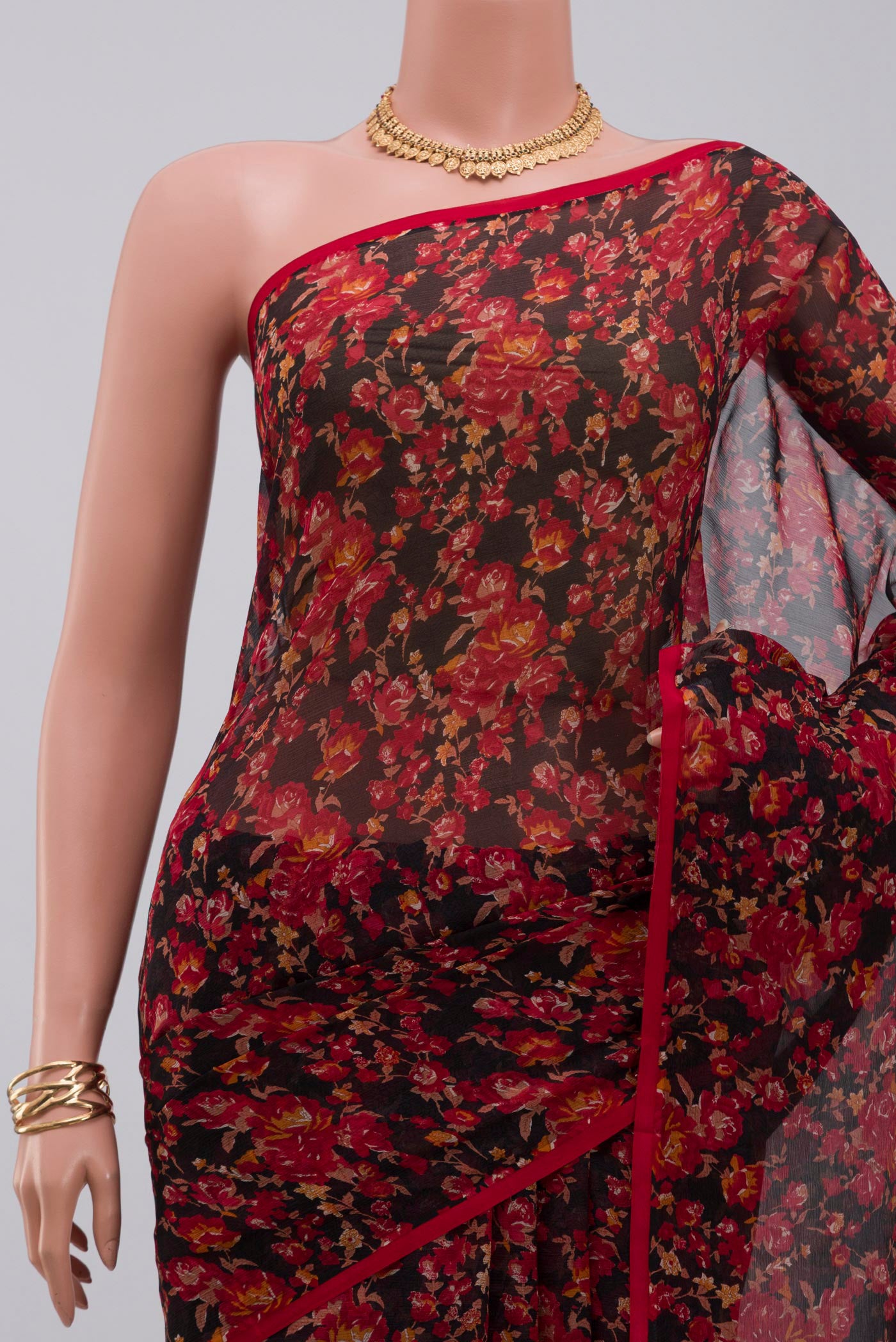 Border image of Black Chiffon Saree with Printed design on the body and Without Border. 