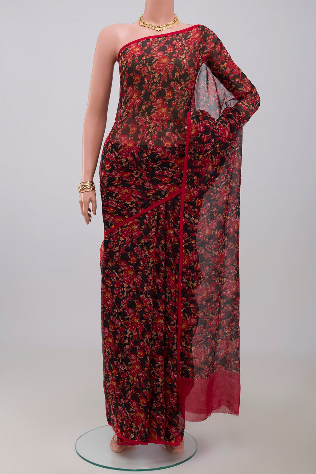 Black Chiffon Saree with Printed design on the body and Without Border.  displayed on a mannequin