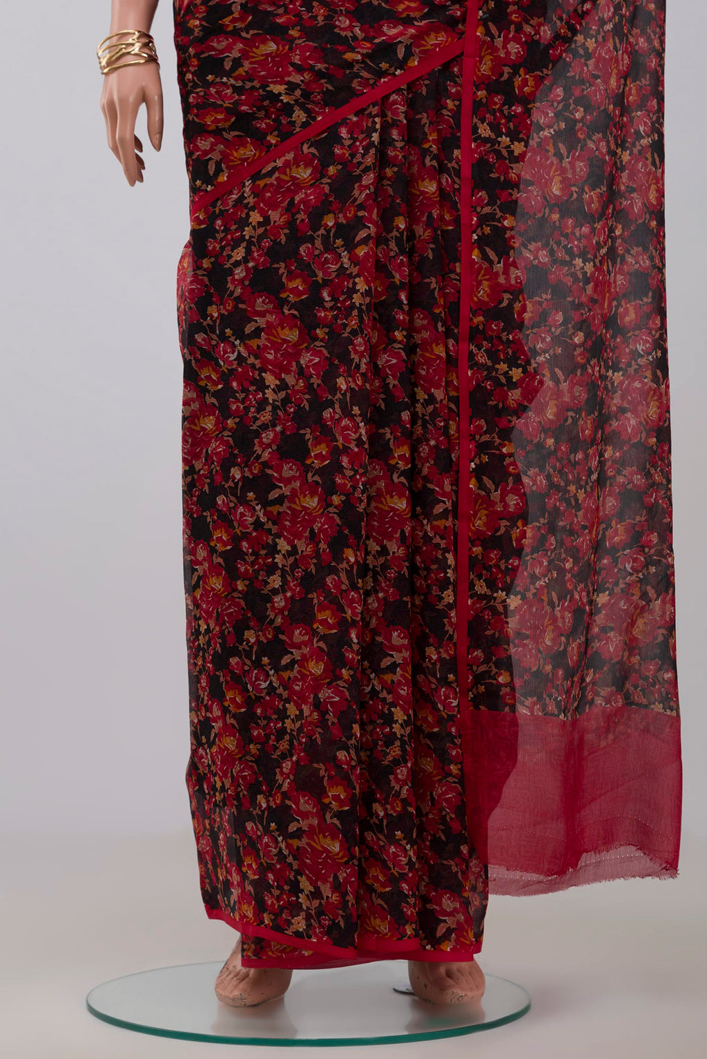 Pleats and pallu of Black Chiffon Saree with Printed design on the body and Without Border. 