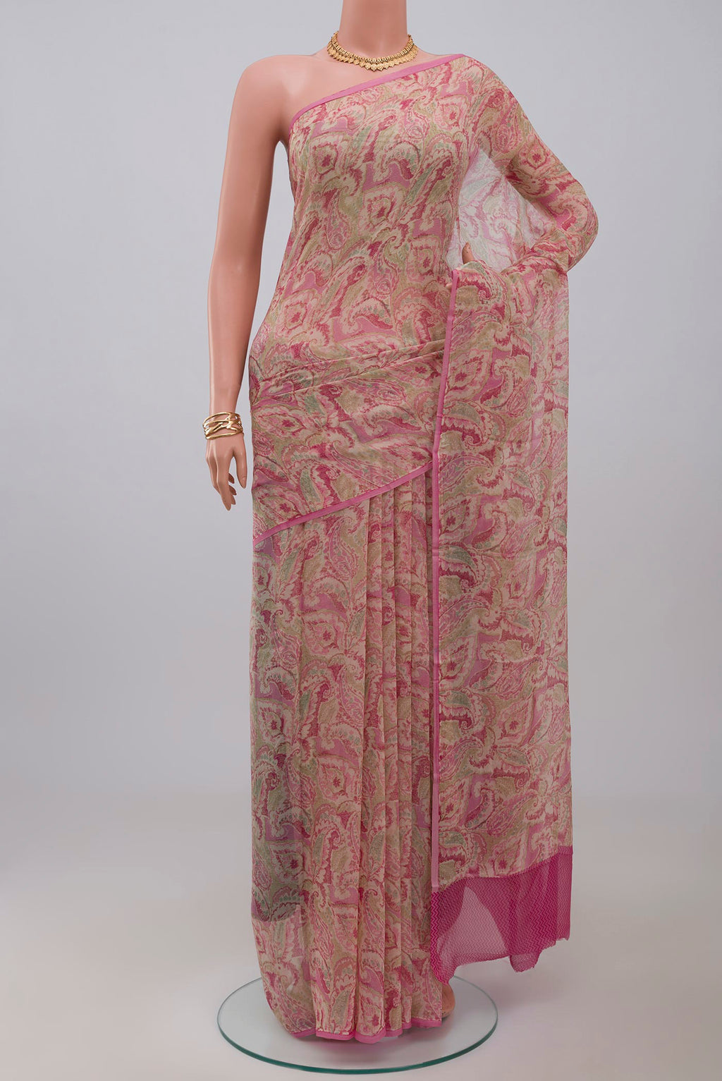 Cream Chiffon Saree with Printed design on the body and Without Border.  displayed on a mannequin