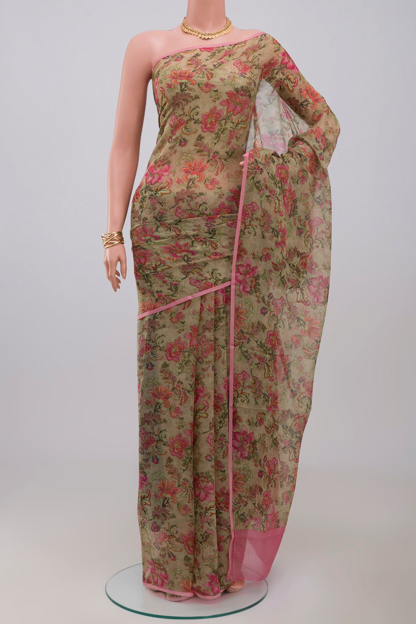 Green Chiffon Saree with Printed design on the body and Without Border.  displayed on a mannequin