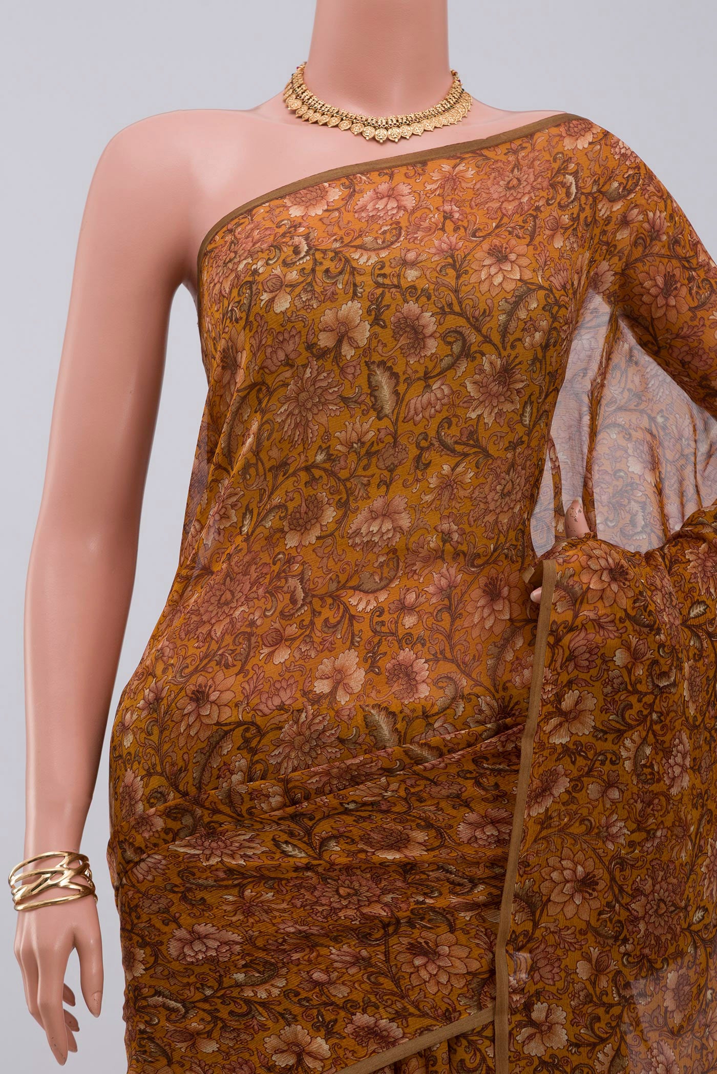 Border image of Mustard Chiffon Saree with Printed design on the body and Without Border. 