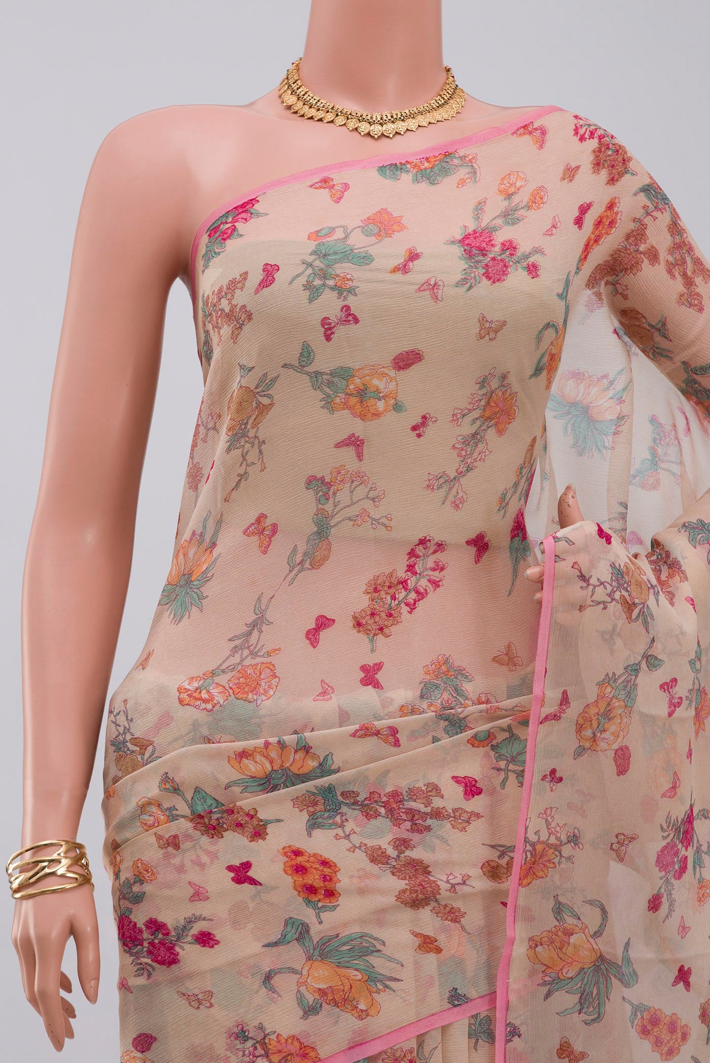 Border image of Cream Chiffon Saree with Printed design on the body and Without Border. 