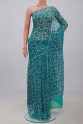 Cream Chiffon Saree with Printed design on the body and Without Border.  displayed on a mannequin
