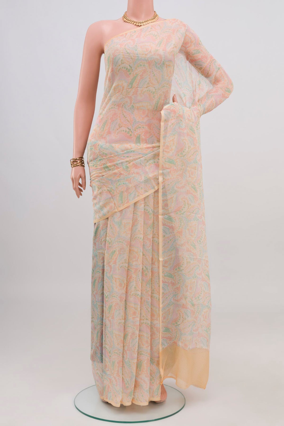 Cream Mysore Chiffon Saree with Printed design on the body and Without Border.  displayed on a mannequin