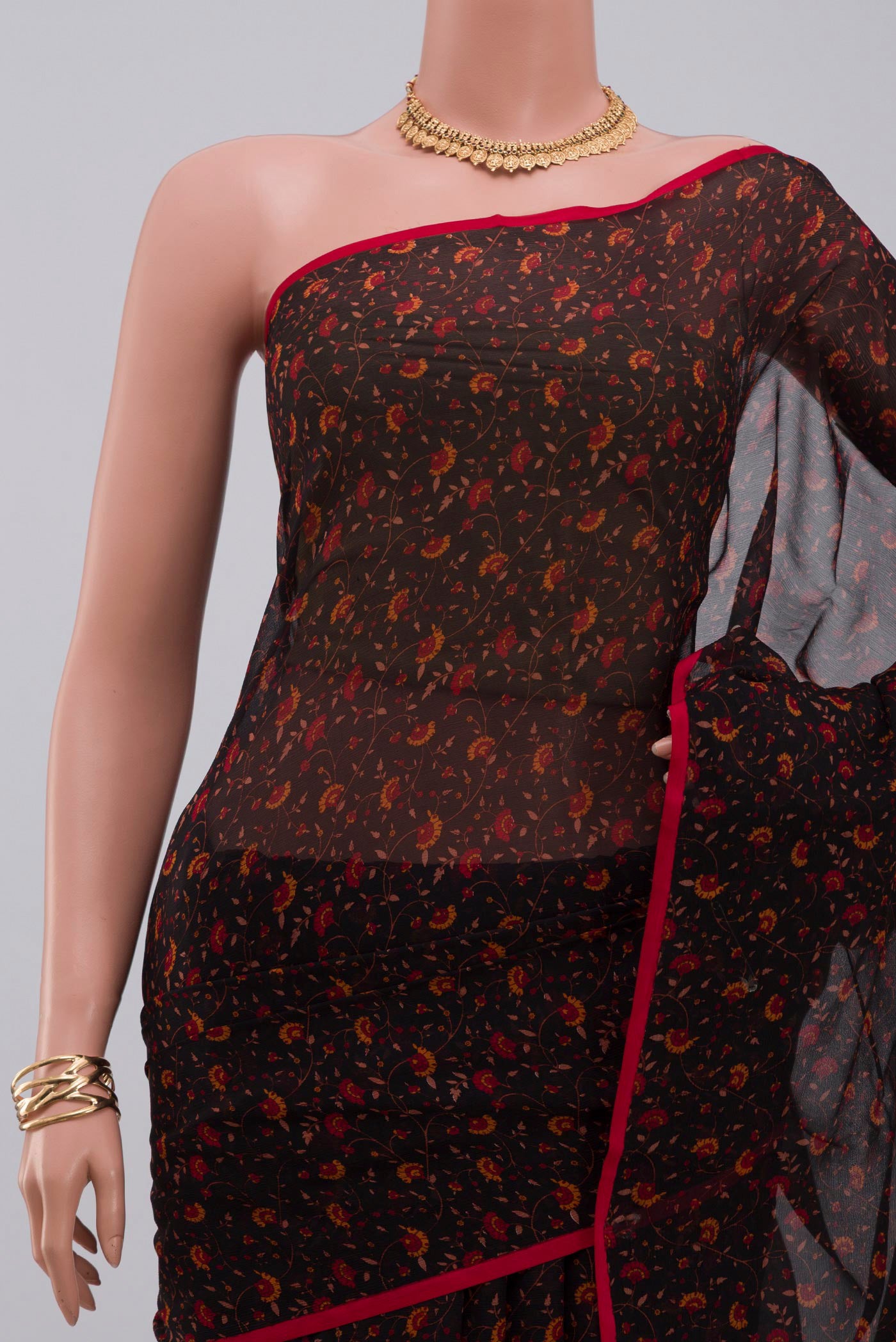 Border image of Black Chiffon Saree with Printed design on the body and Without Border. 