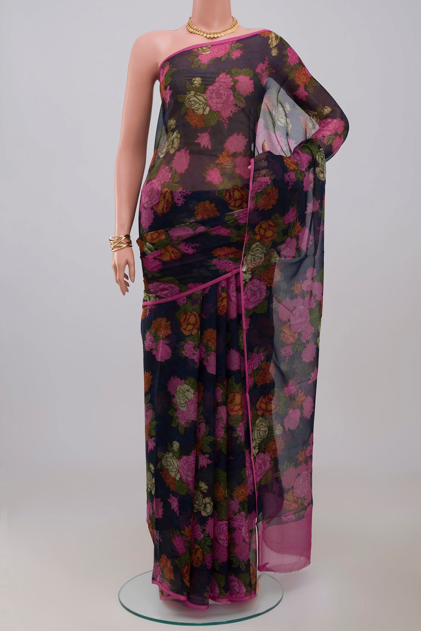 Blue Chiffon Saree with Printed design on the body and Without Border.  displayed on a mannequin