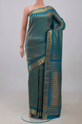 Peacock Blue Kanchipuram Silk Saree with Zari Brocade on the body and Zari Border.  displayed on a mannequin