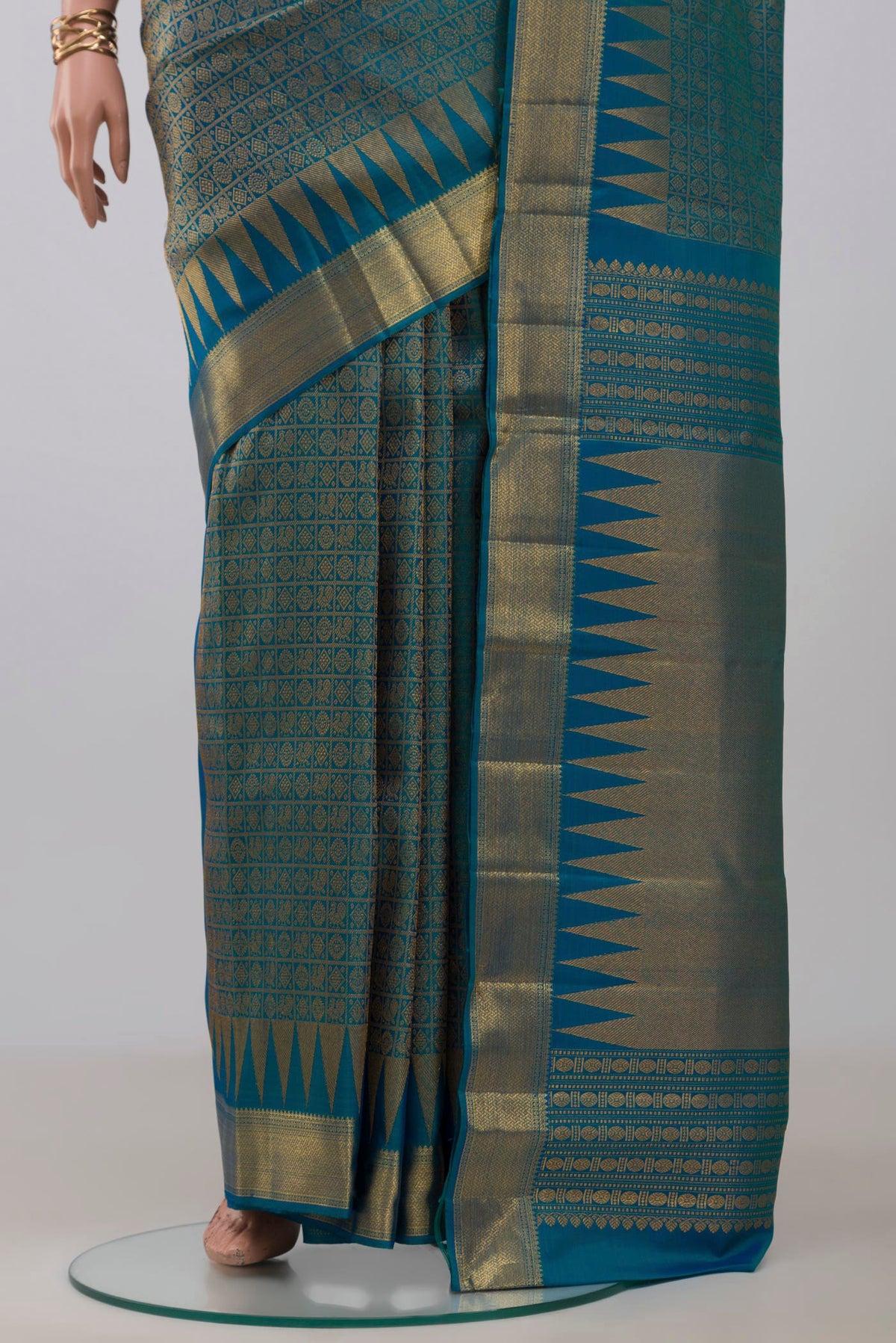 Pleats and pallu of Peacock Blue Kanchipuram Silk Saree with Zari Brocade on the body and Zari Border. 
