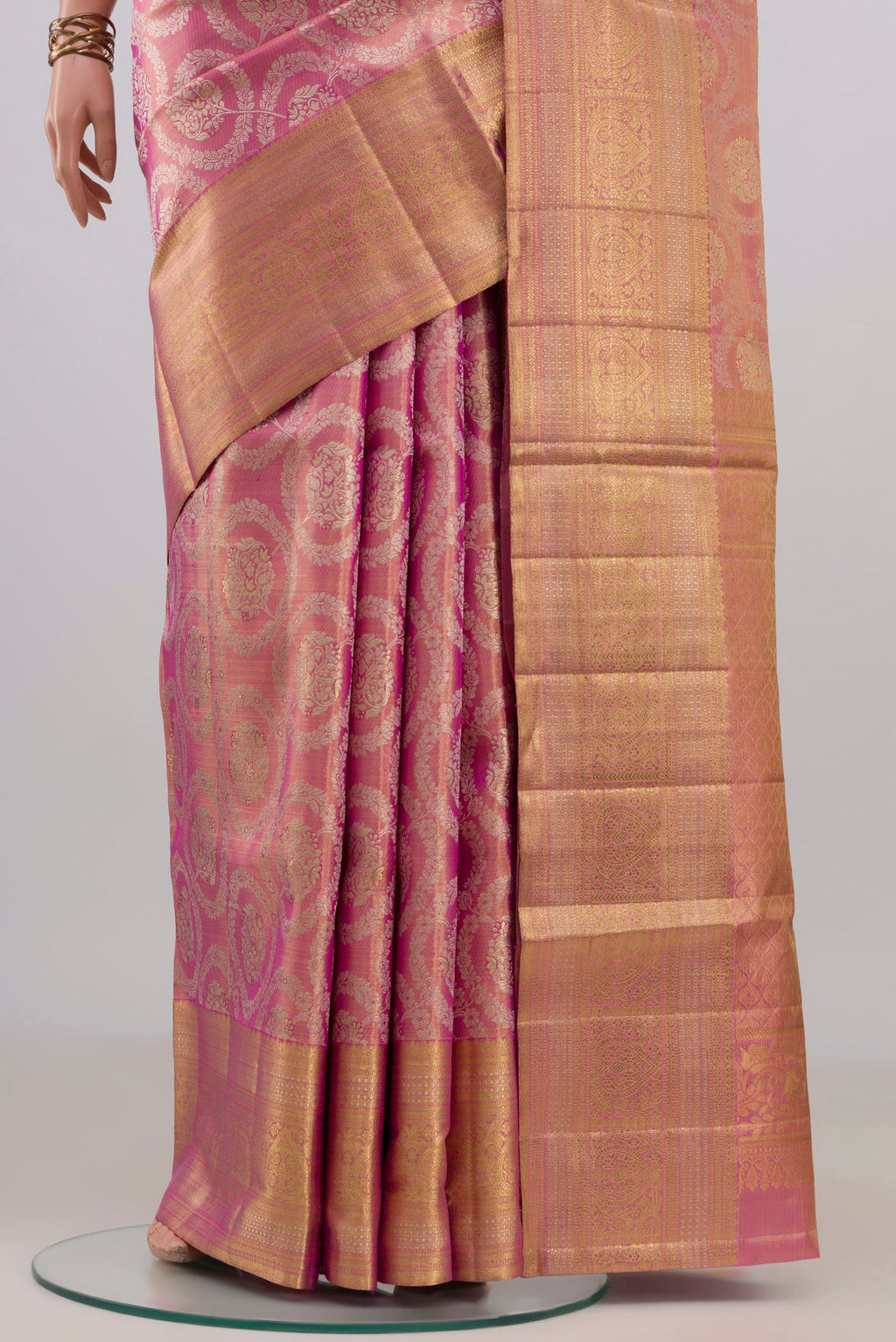 Pleats and pallu of Pink Kanjivaram Tissue Saree with Zari Brocade on the body and Zari Border. 