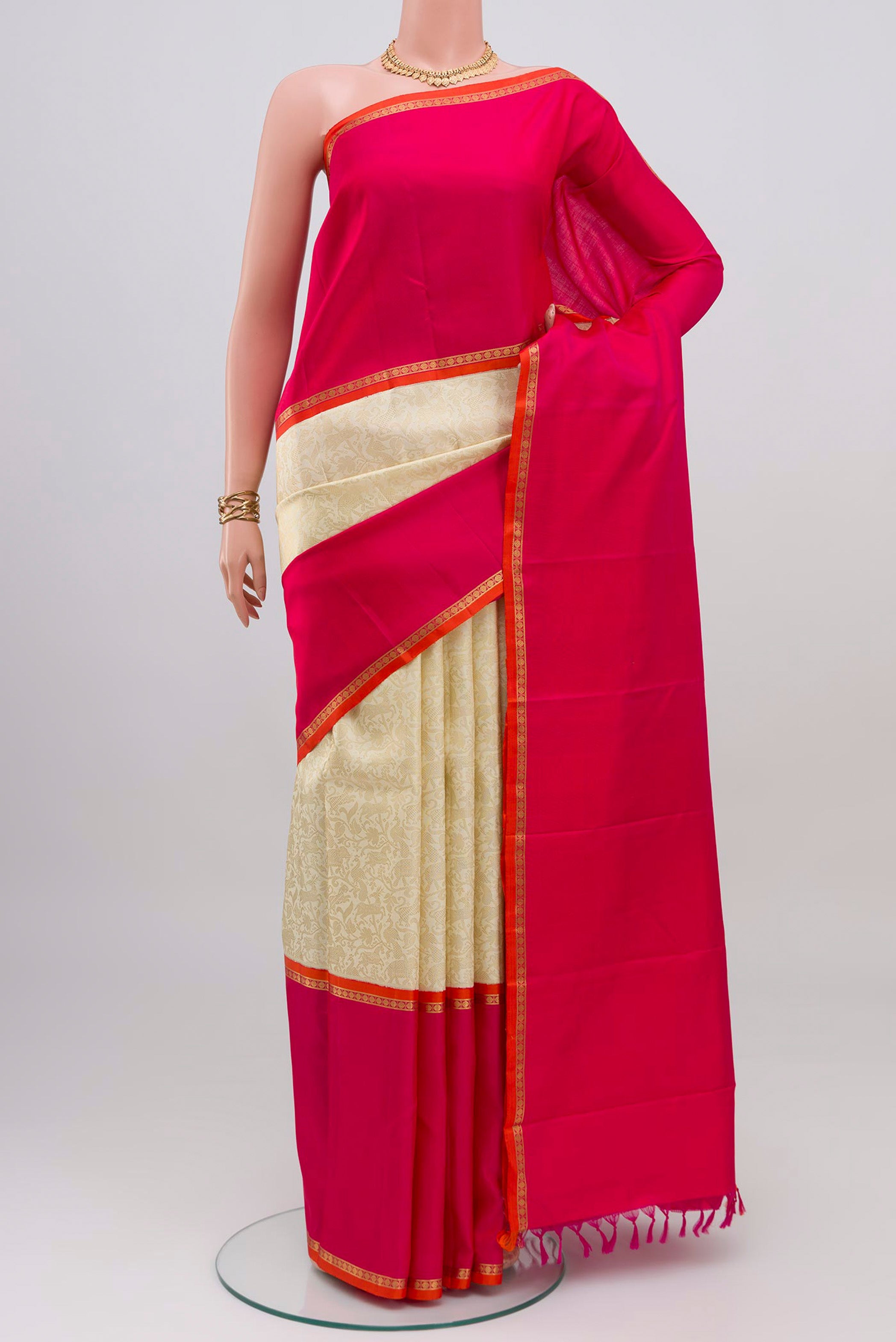 Pure Silk Pure Zari Off White Kanjivaram Saree with Zari Brocade on the body and Zari Border.  displayed on a mannequin