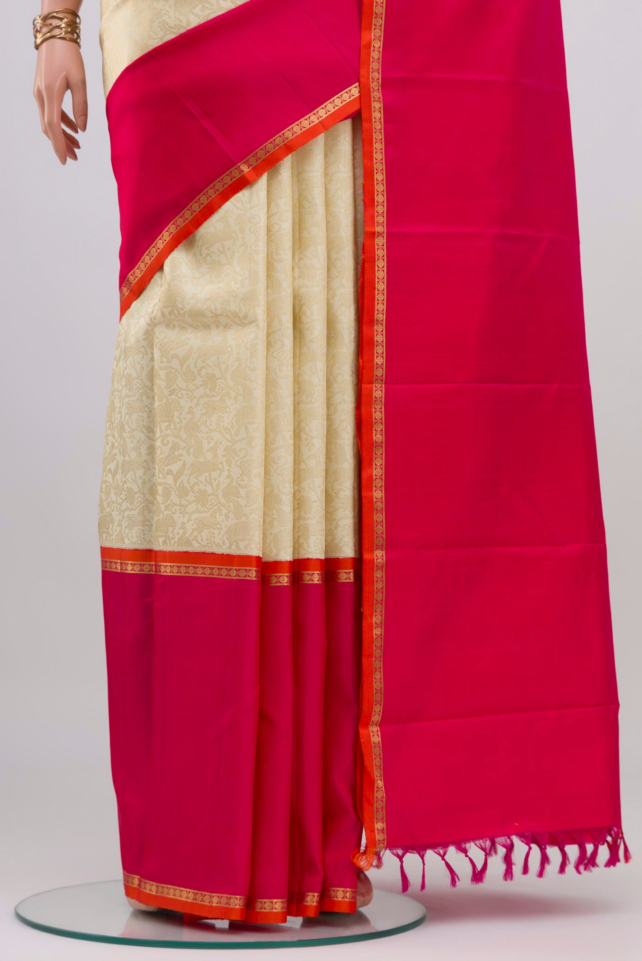 Pleats and pallu of Pure Silk Pure Zari Off White Kanjivaram Saree with Zari Brocade on the body and Zari Border. 