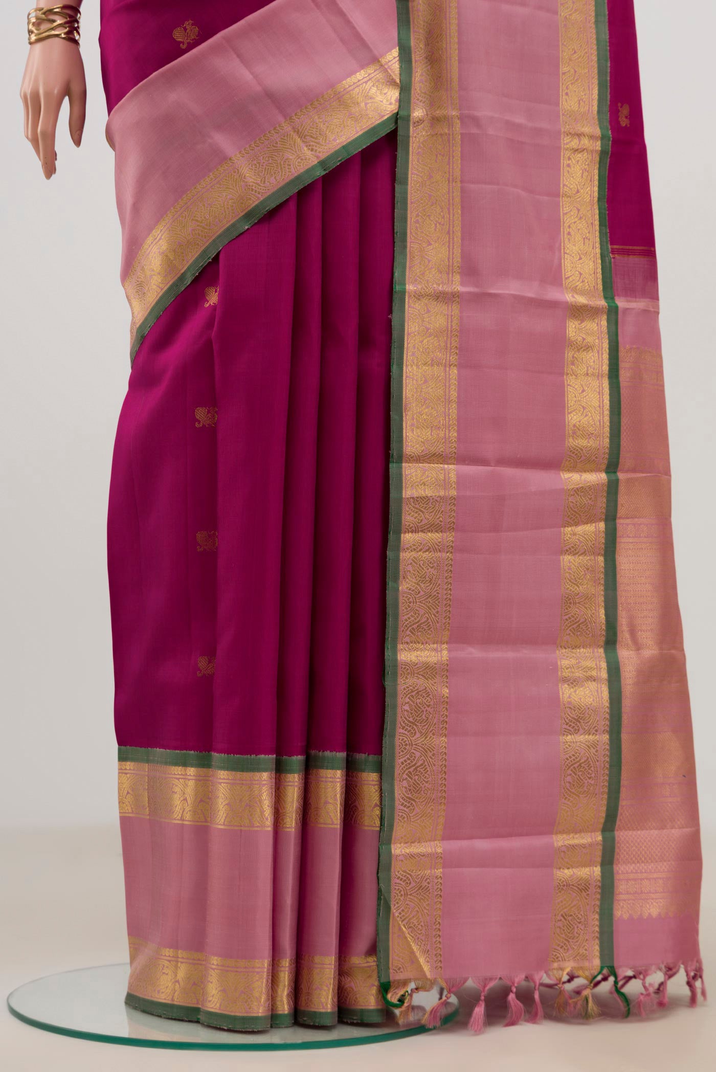 Pleats and pallu of Pure Silk Pure Zari Pink Kanjivaram Saree with Zari Butta on the body and Zari Border. 