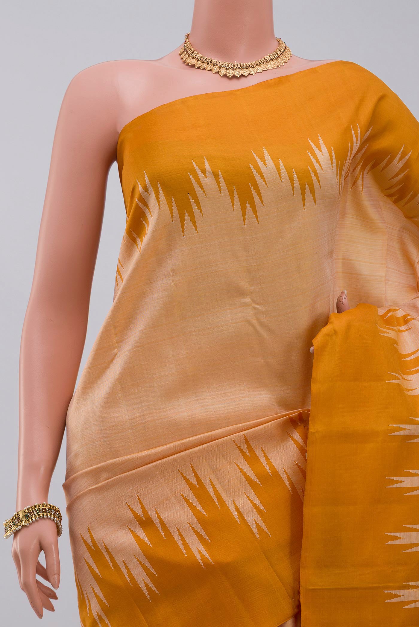 Border image of Mustard Kanchipuram Silk Saree with Plain Body and Temple Border. 
