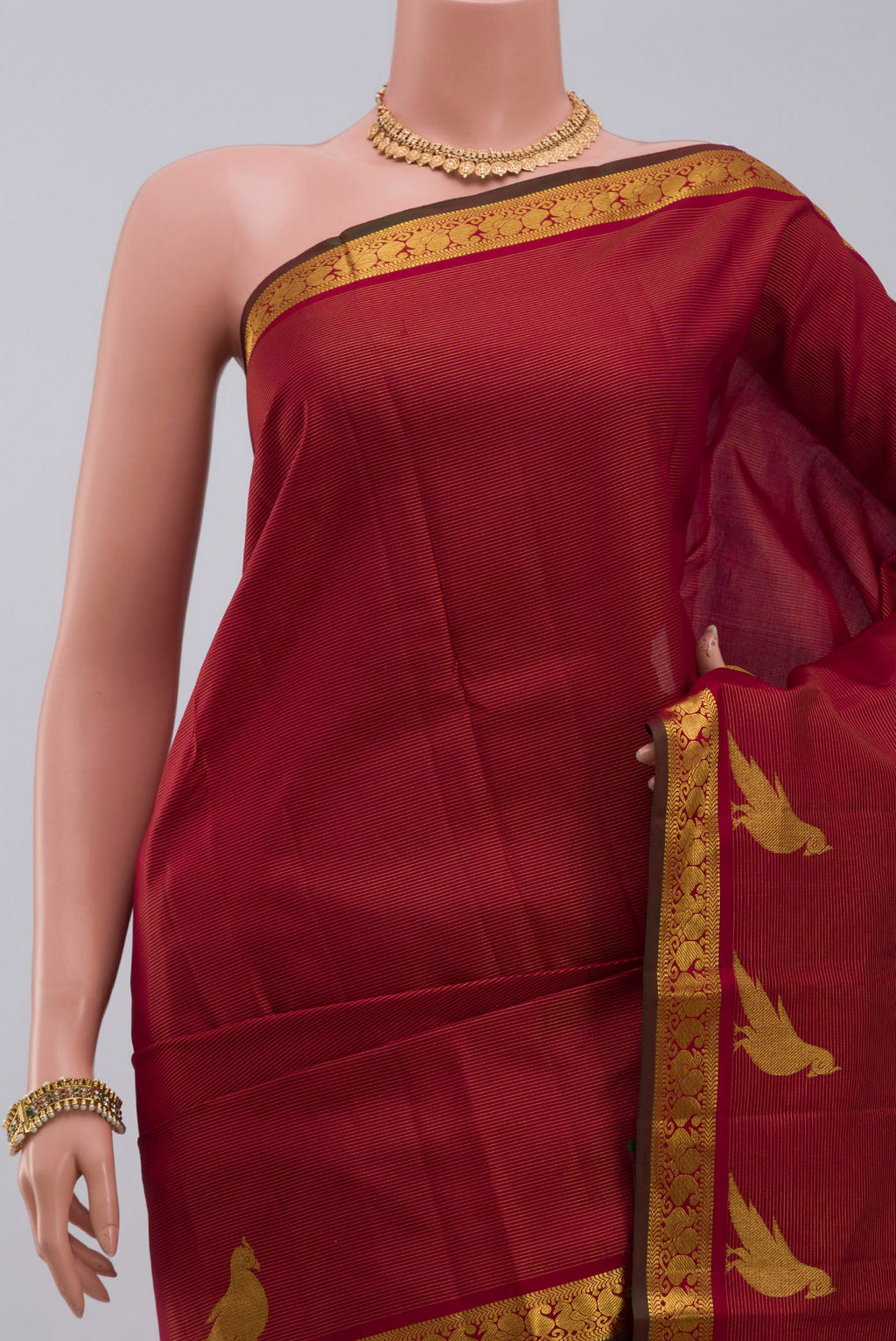 Border image of Maroon Kanchipuram Silk Saree with Stripes on the body and Zari Border. 