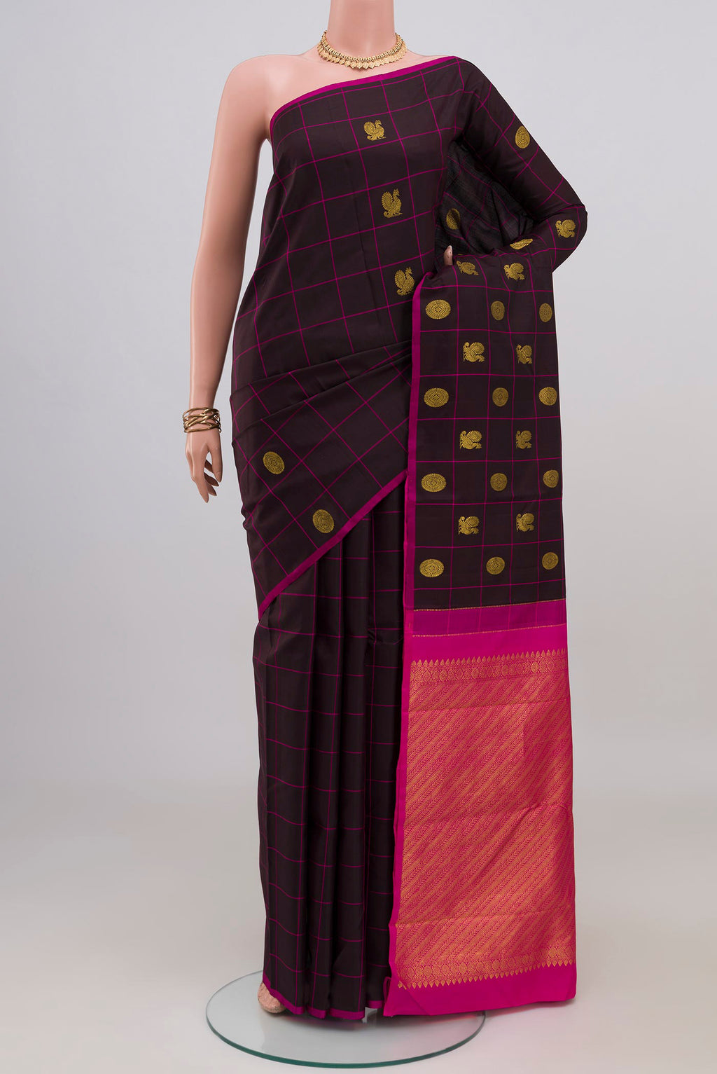 Black Kanchipuram Silk Saree with Checked design on the body and Without Border.  displayed on a mannequin