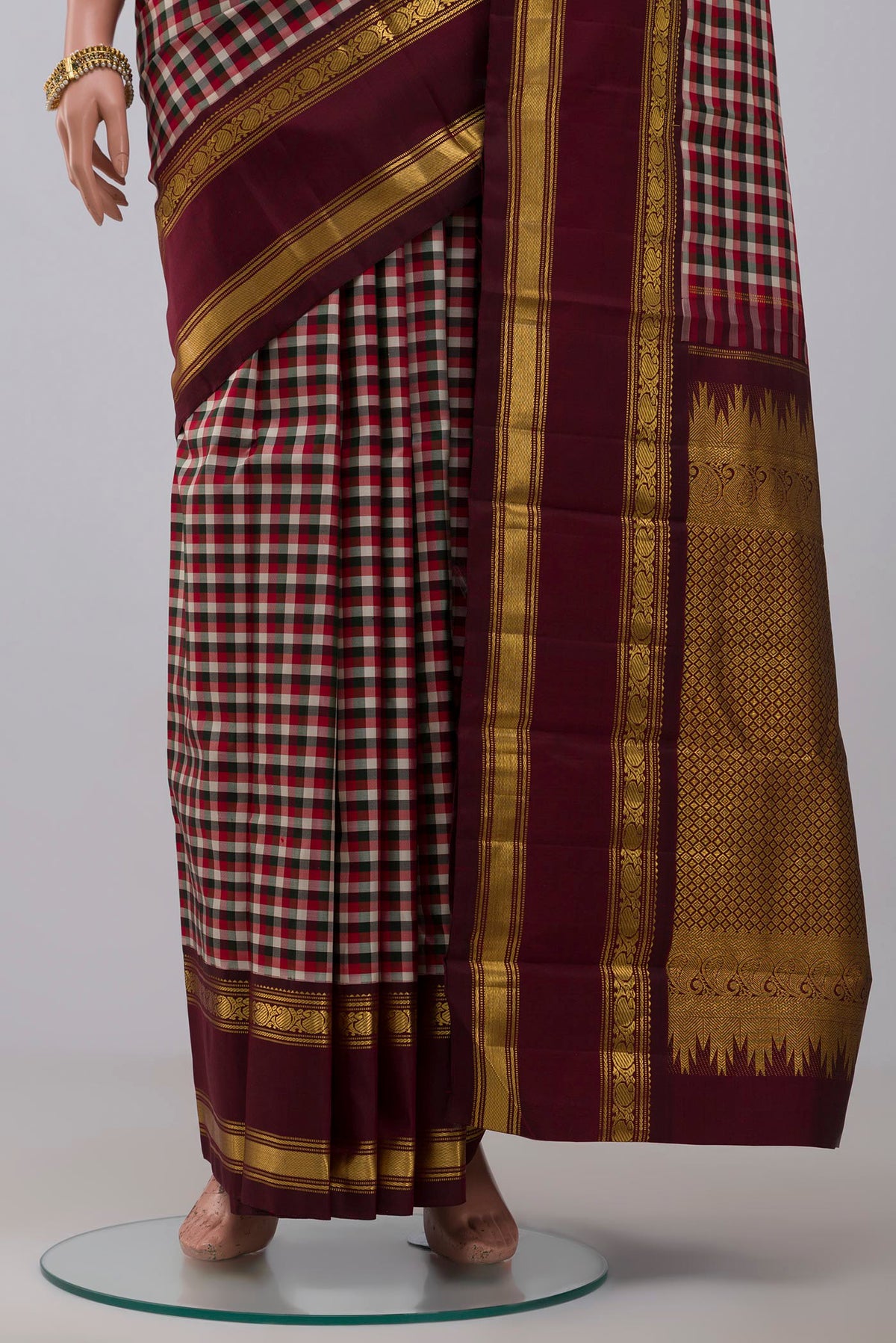 Pleats and pallu of Pure Silk Pure Zari Multi Color Kanchipuram Saree with Checked design on the body and Zari Border. 