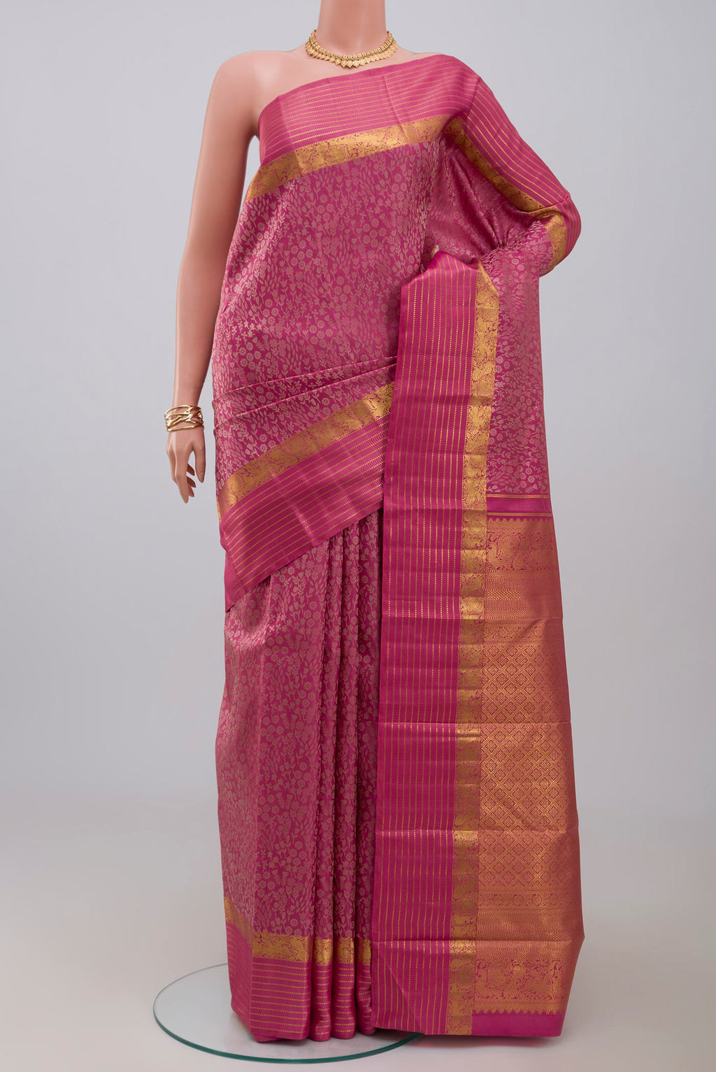 Pure Silk Pure Zari Pink Kanjivaram Saree with Jacquard design on the body and Zari Border.  displayed on a mannequin