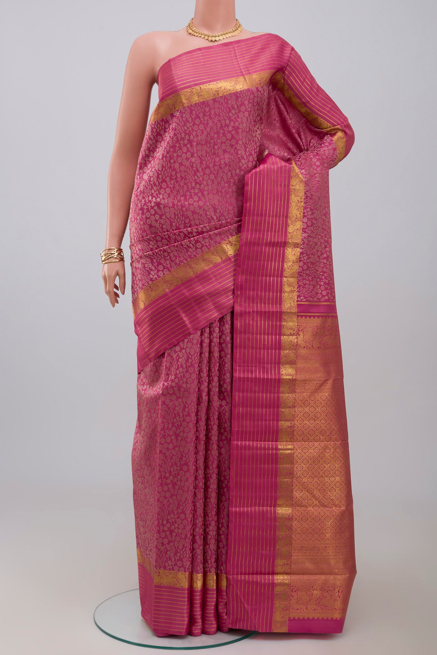 Pure Silk Pure Zari Pink Kanjivaram Saree with Jacquard design on the body and Zari Border.  displayed on a mannequin