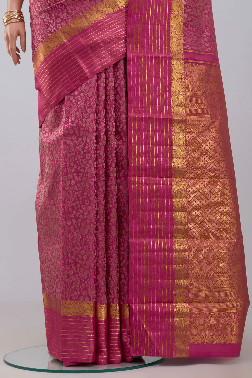 Pleats and pallu of Pure Silk Pure Zari Pink Kanjivaram Saree with Jacquard design on the body and Zari Border. 