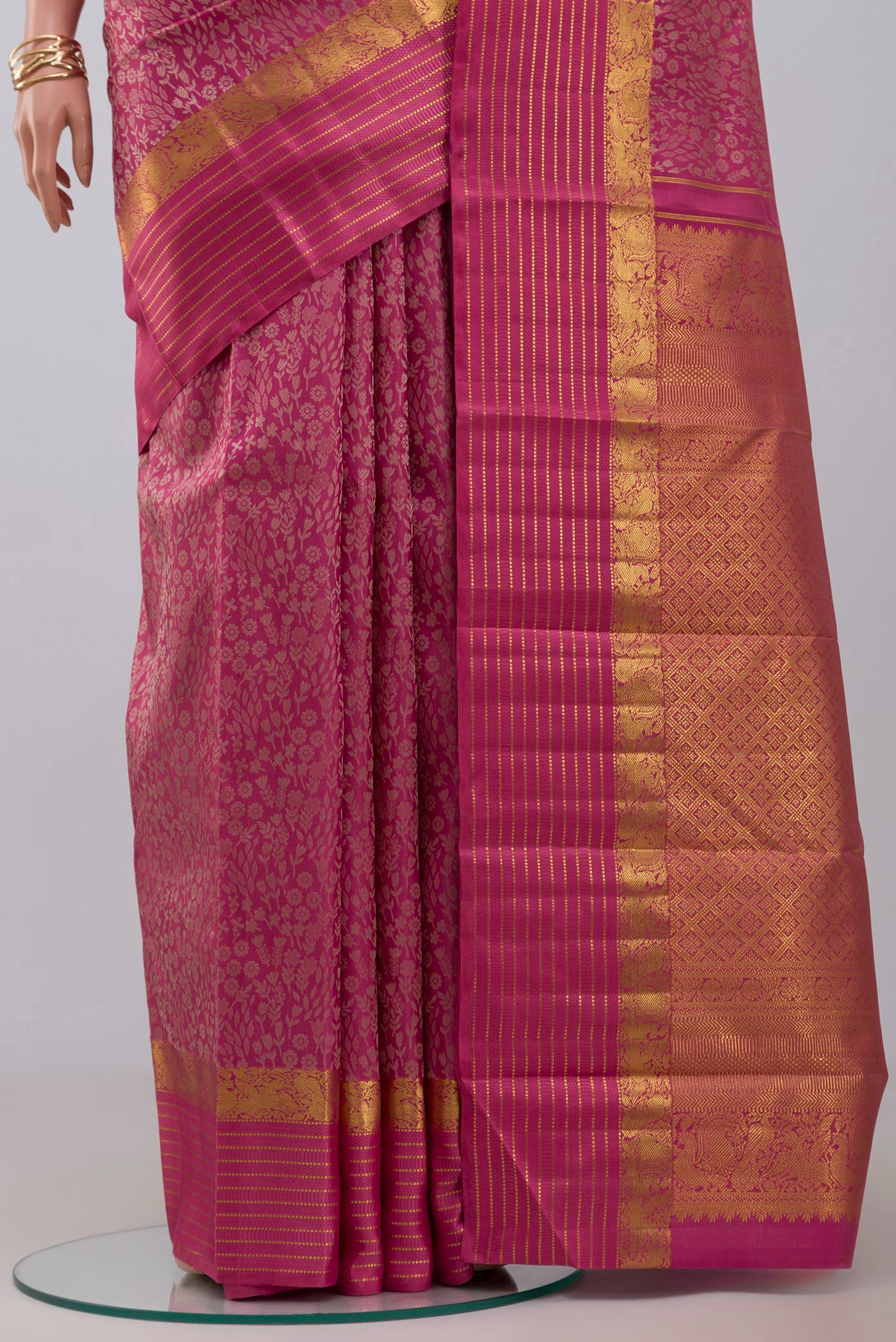 Pleats and pallu of Pure Silk Pure Zari Pink Kanjivaram Saree with Jacquard design on the body and Zari Border. 