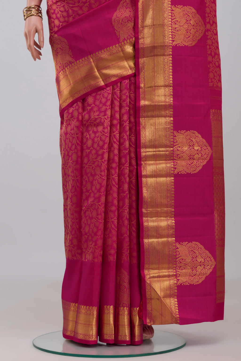 Pleats and pallu of Pink Kanchipuram Silk Saree with Jacquard design on the body and Zari Border. 