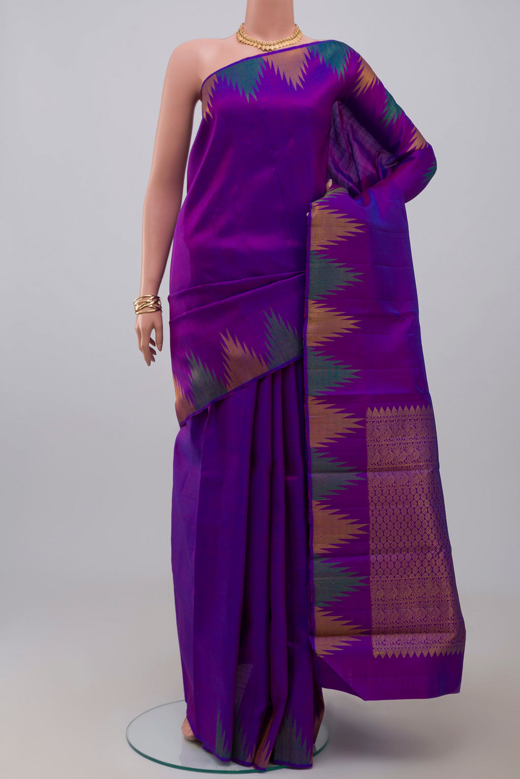 Purple Kanjivaram Saree with Plain Body and Temple Border.  displayed on a mannequin