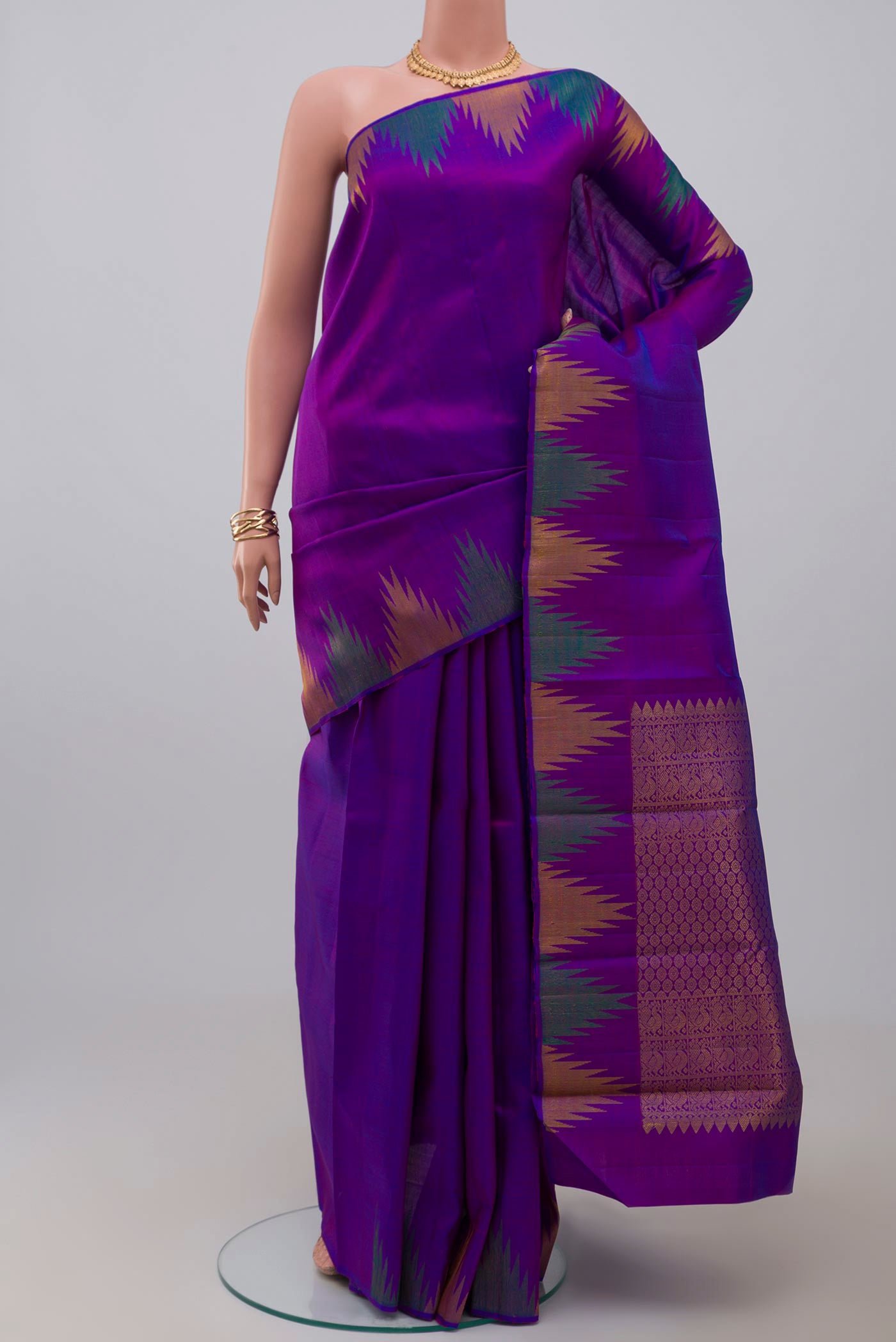 Purple Kanjivaram Saree with Plain Body and Temple Border.  displayed on a mannequin