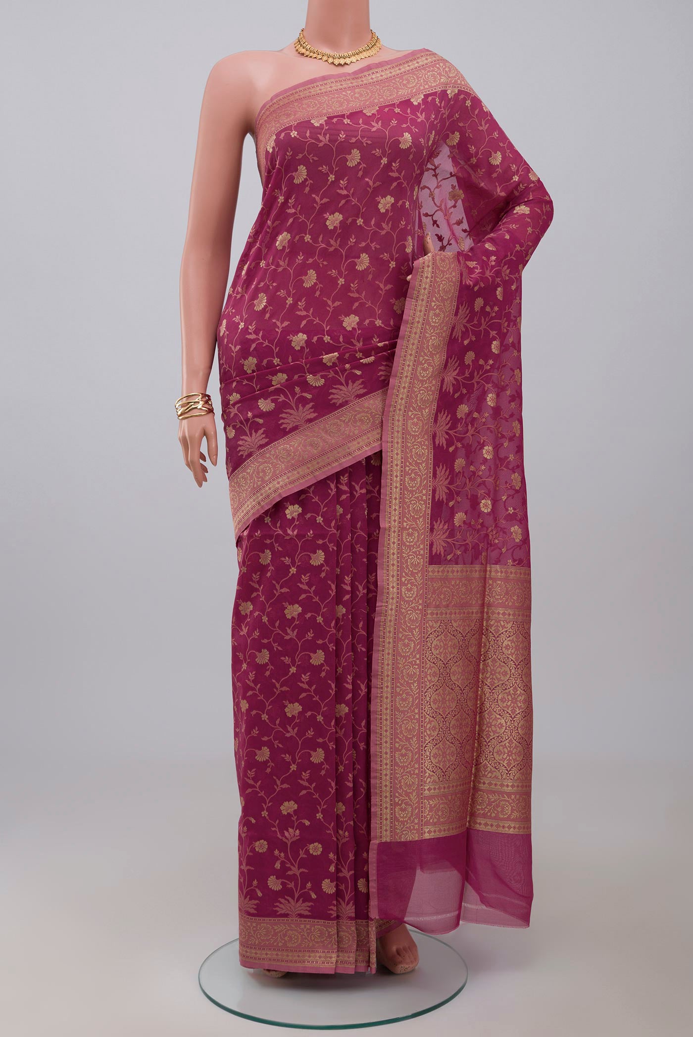 Pink Banarasi Saree with Fancy on the body and Fancy Border.  displayed on a mannequin