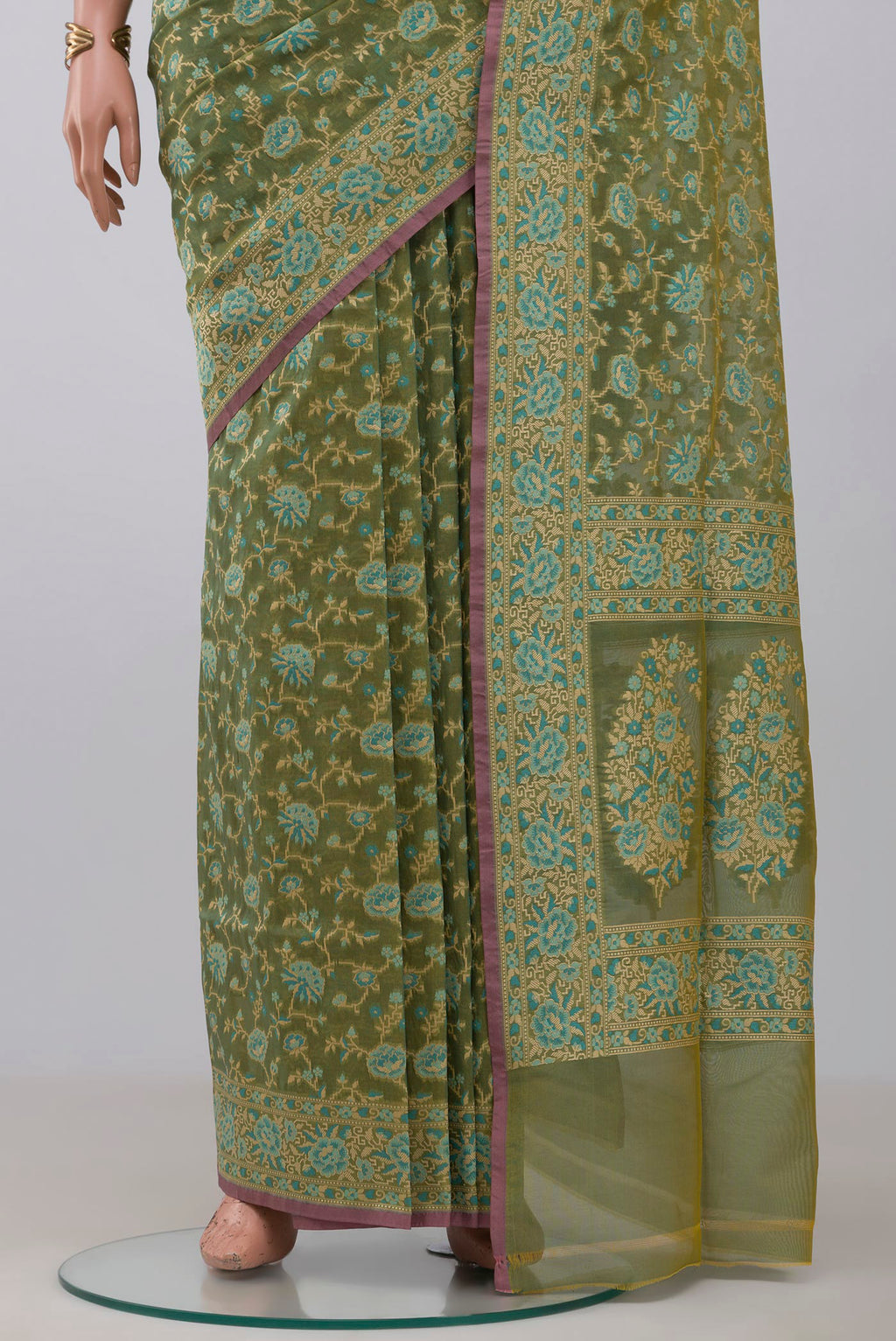 Pleats and pallu of Olive Green Banarasi Silk Saree with Zari And Thread Butta on the body and Zari Border. 