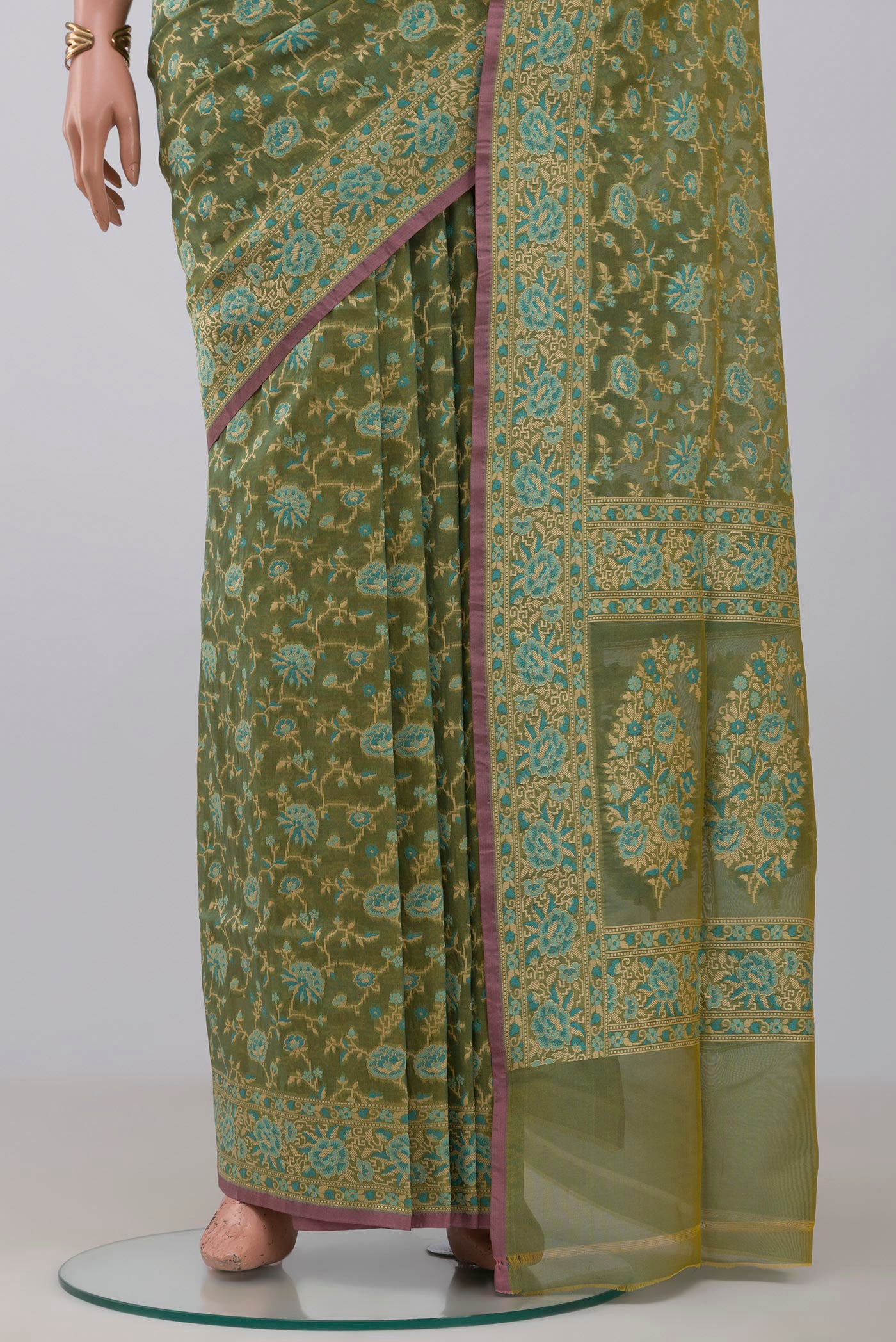 Pleats and pallu of Olive Green Banarasi Silk Saree with Zari And Thread Butta on the body and Zari Border. 