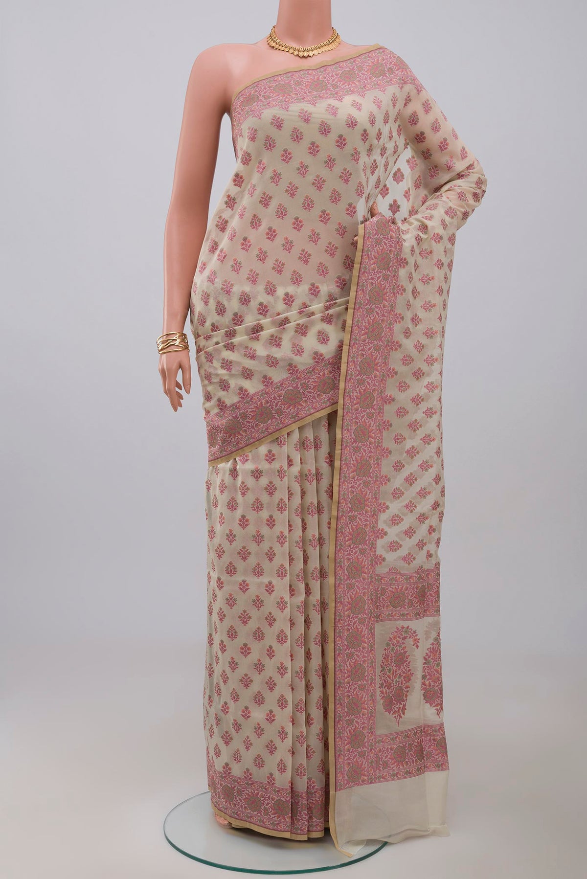 Off White Banarasi Saree with Thread Butta on the body and Thread Border.  displayed on a mannequin