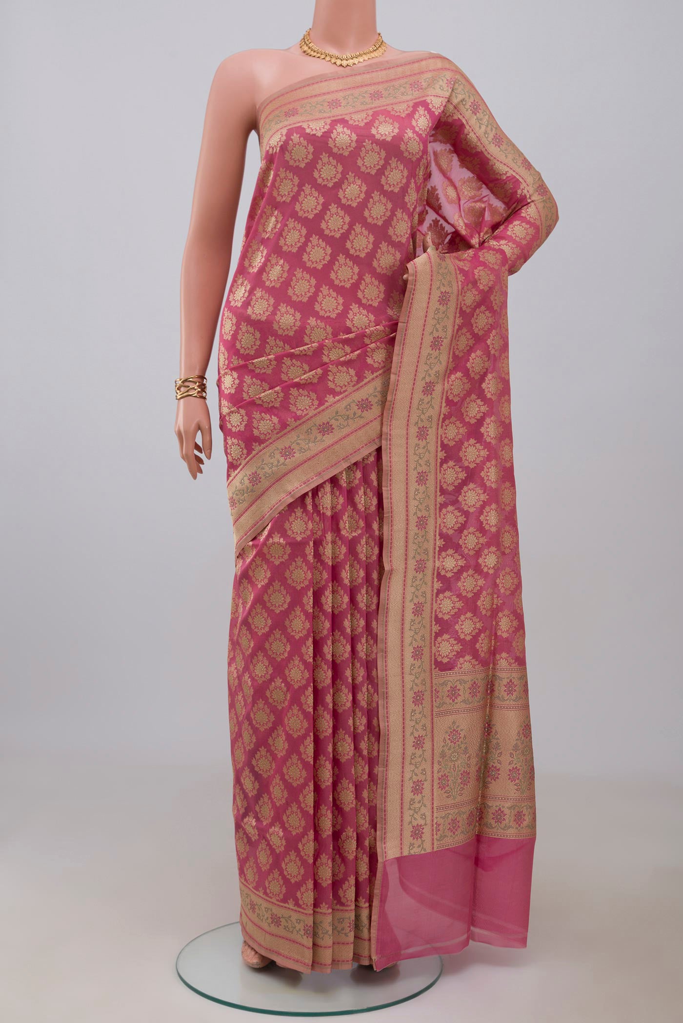 Pink Banarasi Silk Saree with Zari Butta on the body and Zari Border.  displayed on a mannequin
