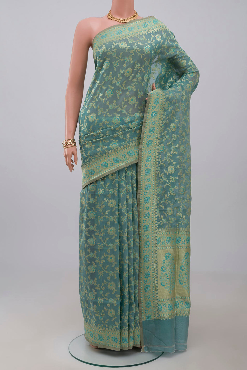 Light Blue Banarasi Saree with Fancy on the body and Fancy Border.  displayed on a mannequin