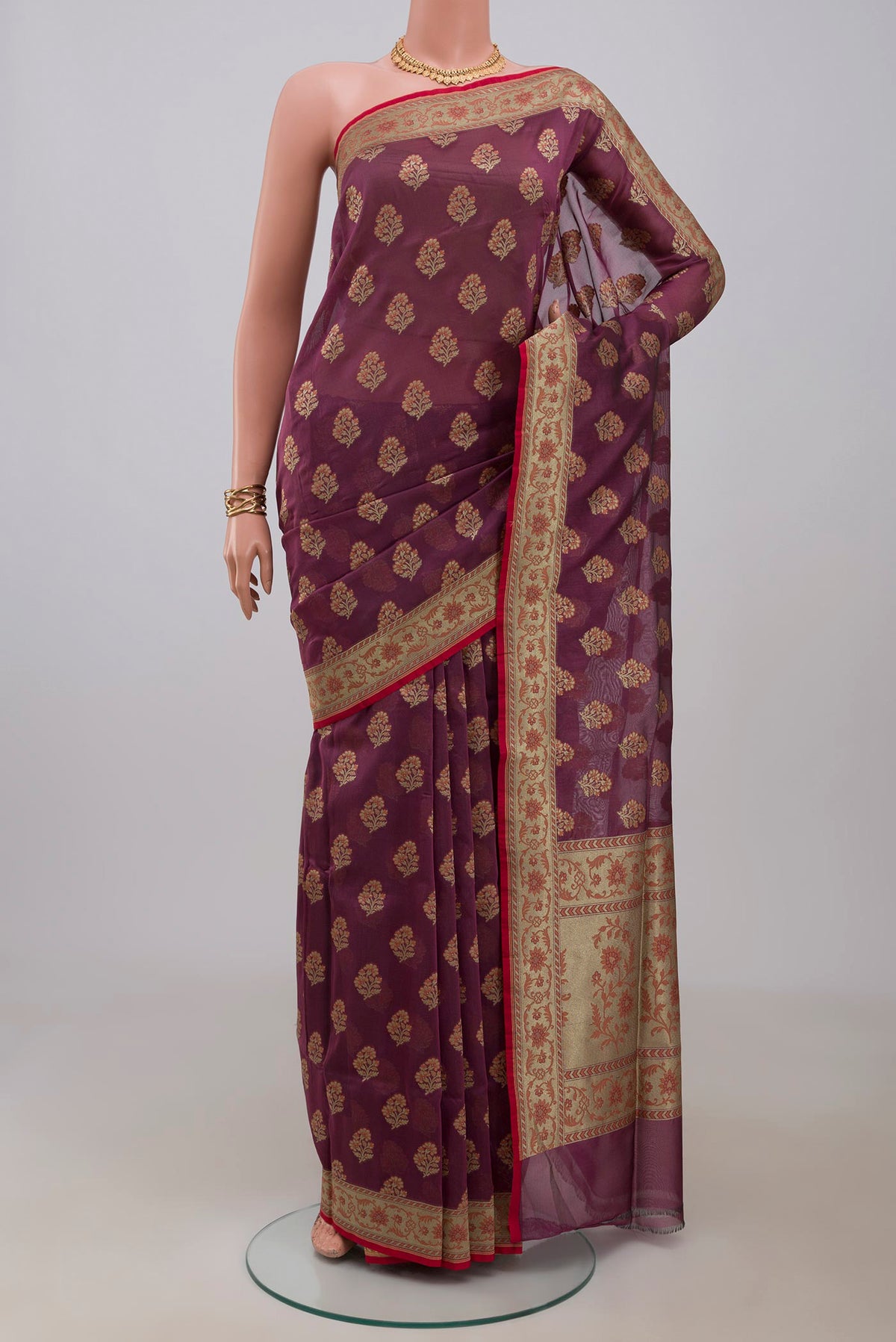 Purple Banarasi Saree with Zari Butta on the body and Fancy Border.  displayed on a mannequin
