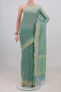 Pure Silk Sky Blue Banarasi Saree with Zari Butta on the body and Zari Border.  displayed on a mannequin