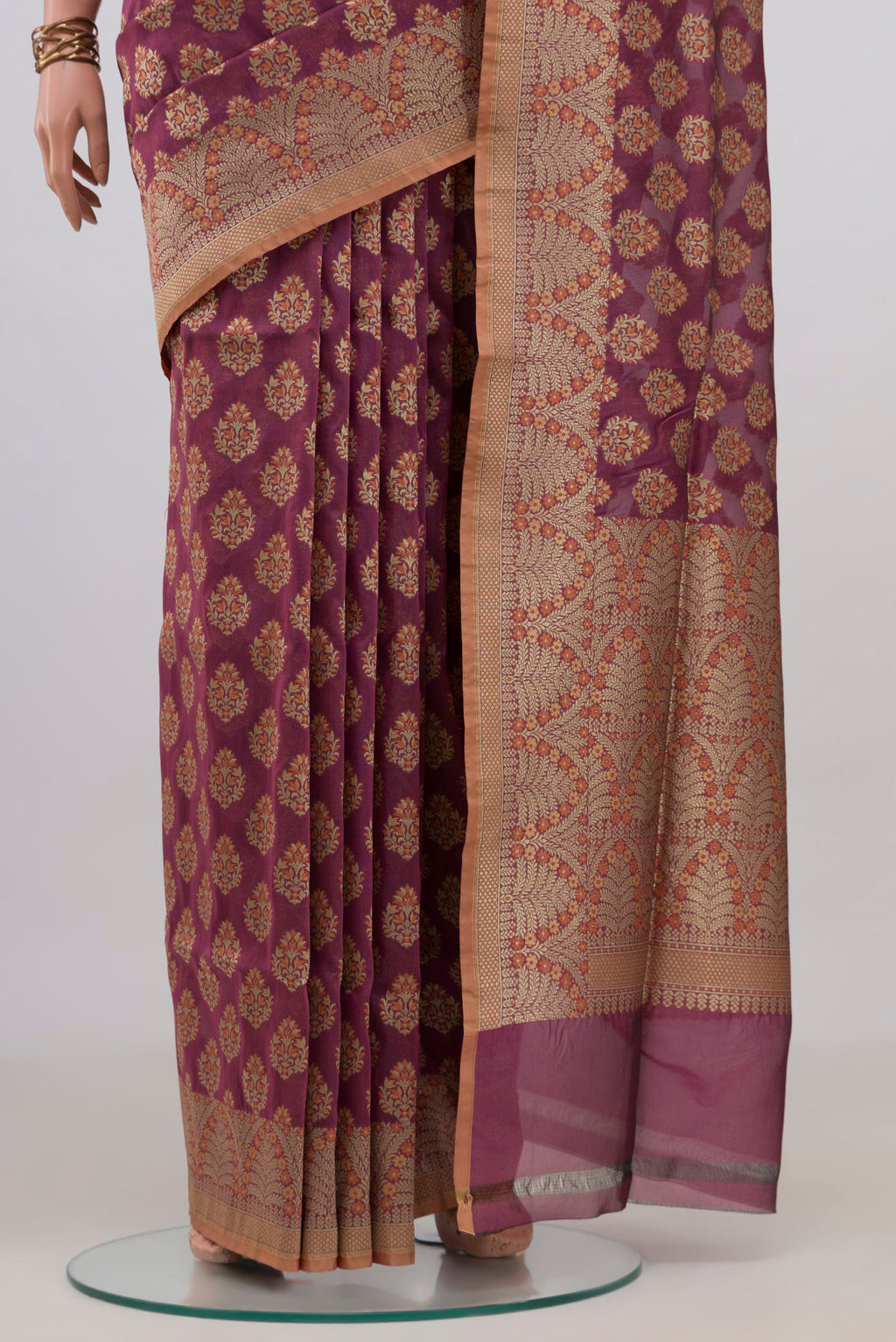 Pleats and pallu of Pure Silk Mauve Banarasi Saree with Zari And Thread Butta on the body and Zari Border. 