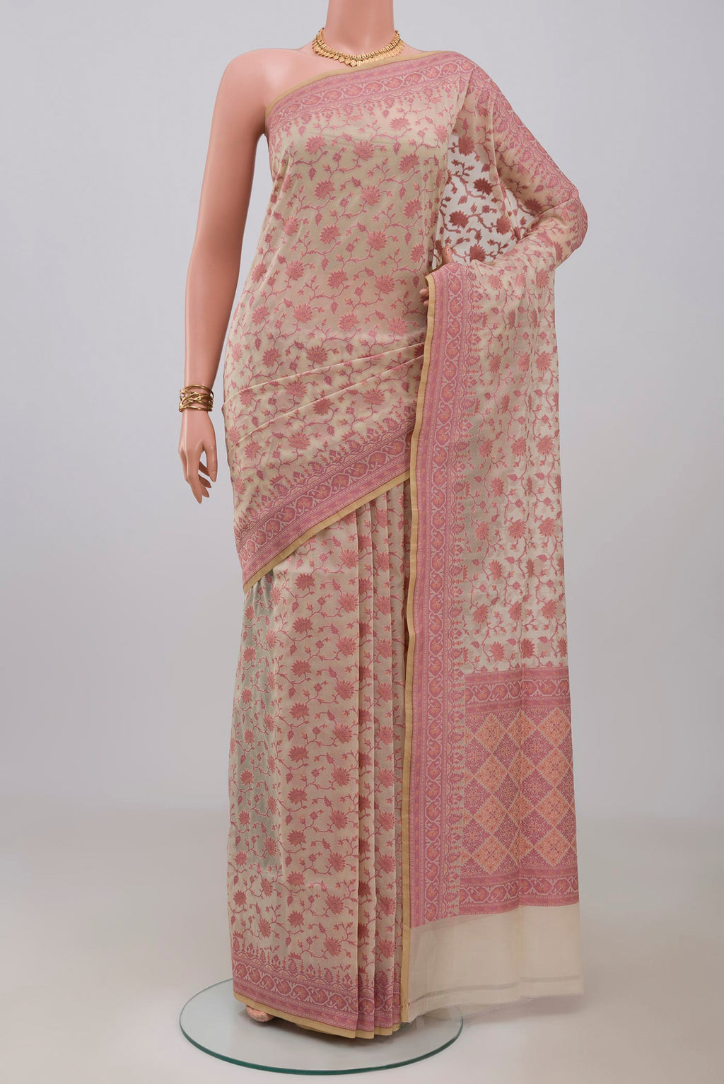 Cream Banarasi Silk Saree with Thread Butta on the body and Thread Border.  displayed on a mannequin