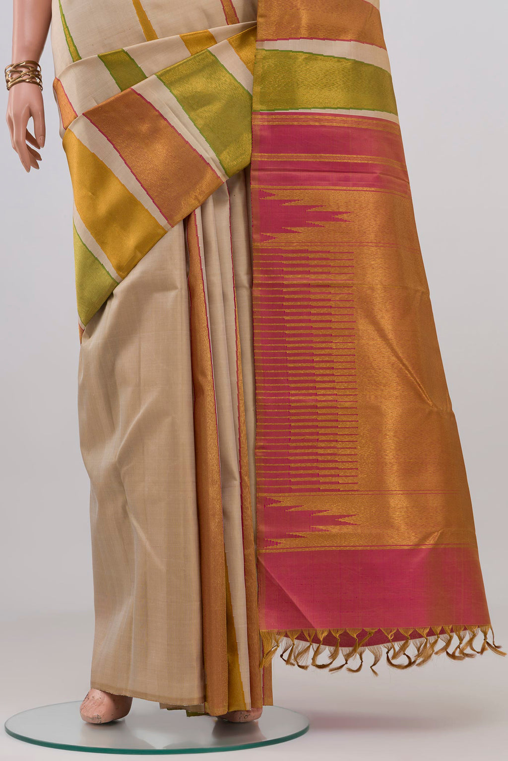 Pleats and pallu of Cream Kanjivaram Silk Saree with Plain Body and Temple Border. 
