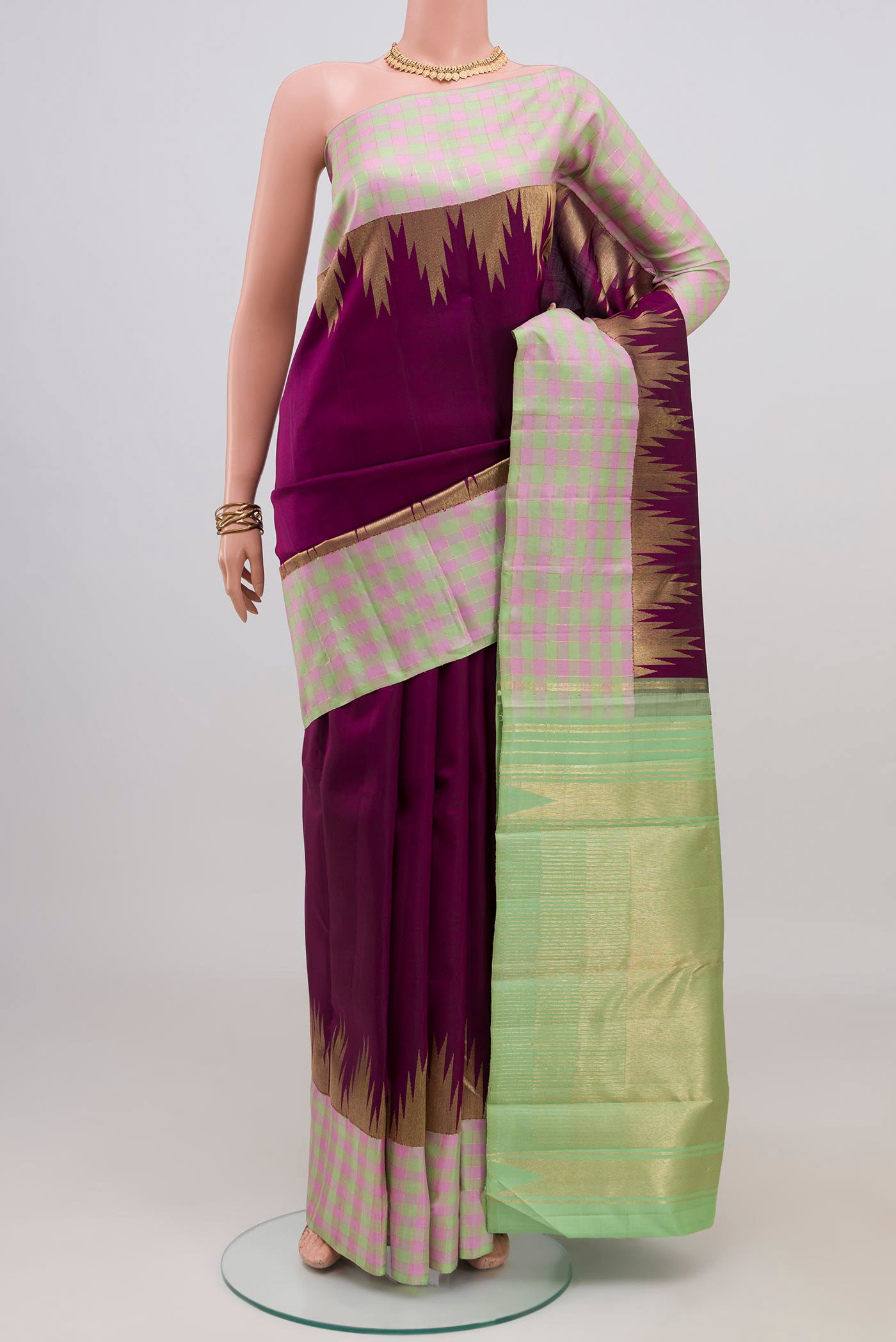 Pure Silk Pure Zari Purple Kanchipuram Saree with Plain Body and Checks Border.  displayed on a mannequin