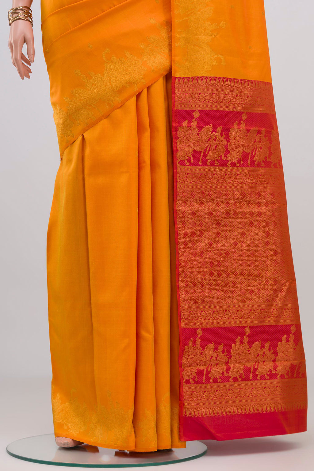 Pleats and pallu of Pure Silk Pure Zari Yellow Kanjivaram Saree with Zari Butta on the body and Fancy Border. 